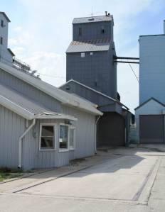 IMG_1179crojpgmediumoptimized The former Farmers Co-op grain elevator office and scale, used until moving to the new location across the street in 2002. The scale dial hung in the window and was used until the early/mid 1980's when it was replaced with a digital readout and printer system. (Click photo to enlarge.).