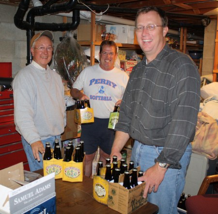 Jim, Bill and Scott divying up the fruits of their labors.  (Click to enlarge photo.)