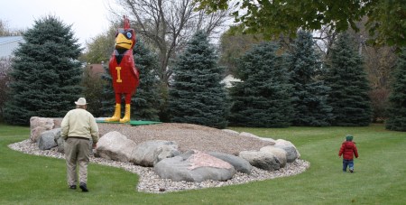IMG_5031 DCG and Jackson walk by Cy 1400 Deane Gunderson, Cy and Jackson in Rolfe, Iowa near the Bud Barn. (Click photo to enlarge.)